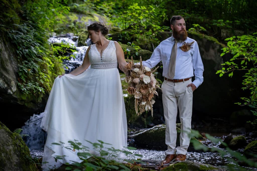 asheville elopement guide couple enjoying a waterfall