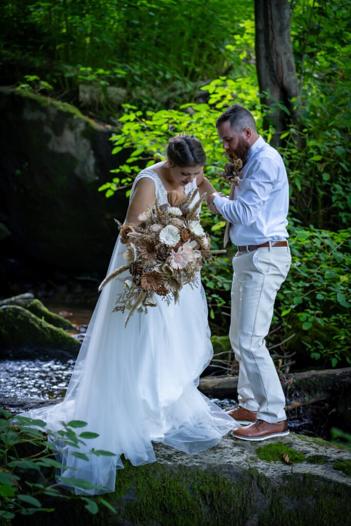 airbnb wedding vs a private venue couple at waterfall ceremony