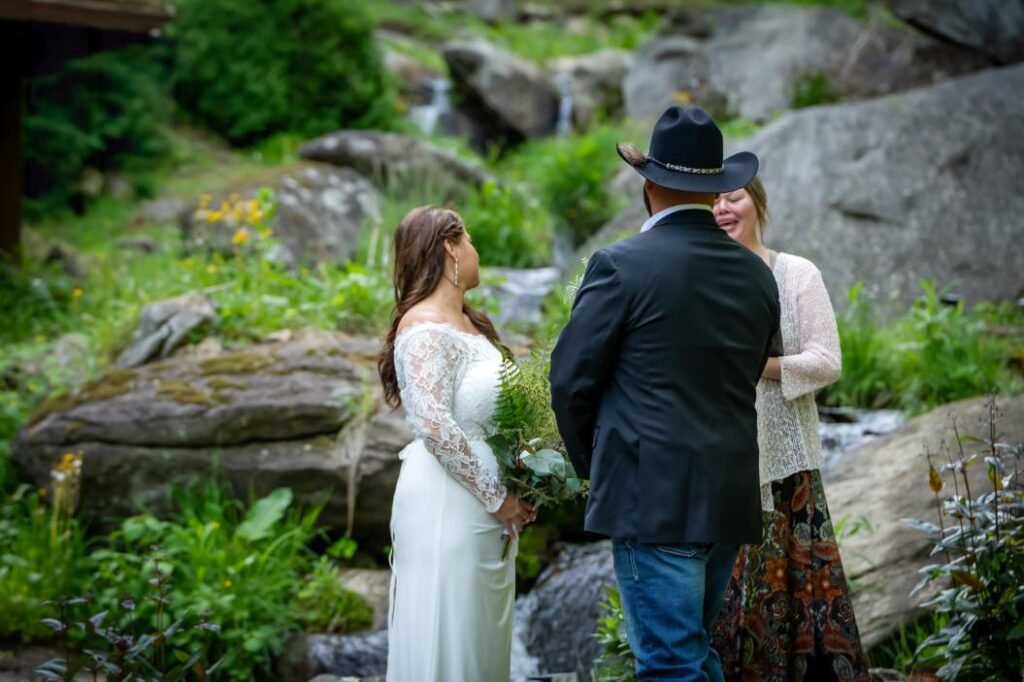couple with officiant at all-inclusive wedding venue in North Carolina